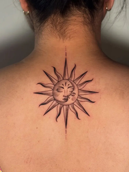 Small Blackwork Sun with Face on Women Nape Tattoo by @sea_of_ink_tattoo_studio