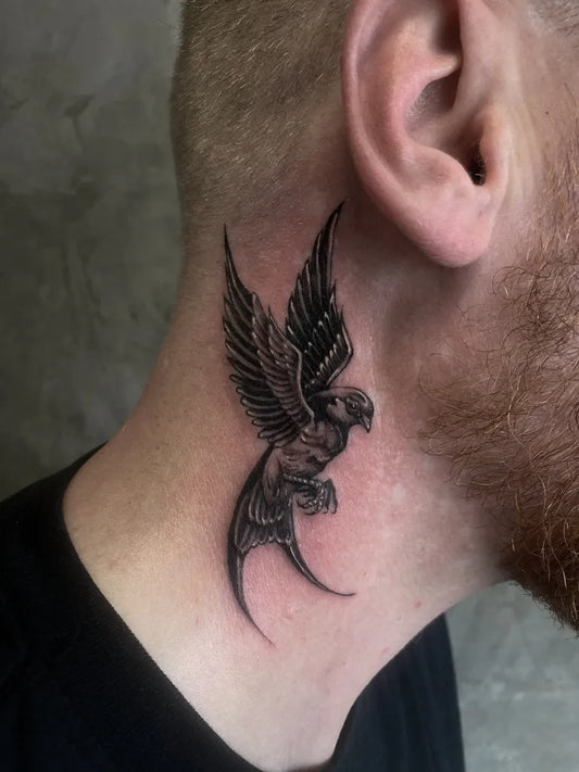 Small Blackwork Swallow Tattoo on Men Neck by @ruby.g.tattooer