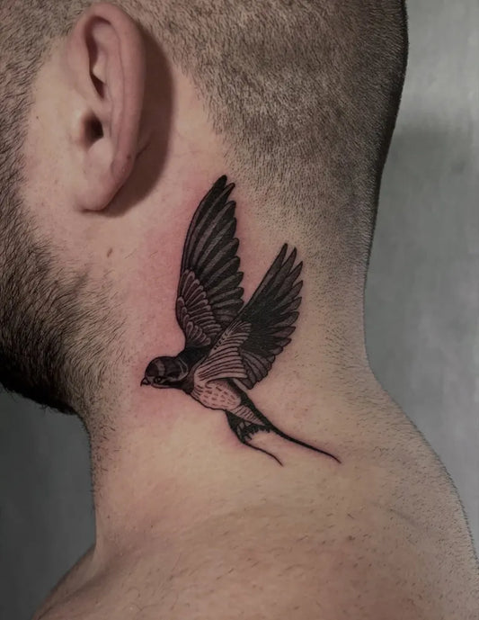 Small Blackwork Swallow Tattoo on Men Neck by @tattoolinka