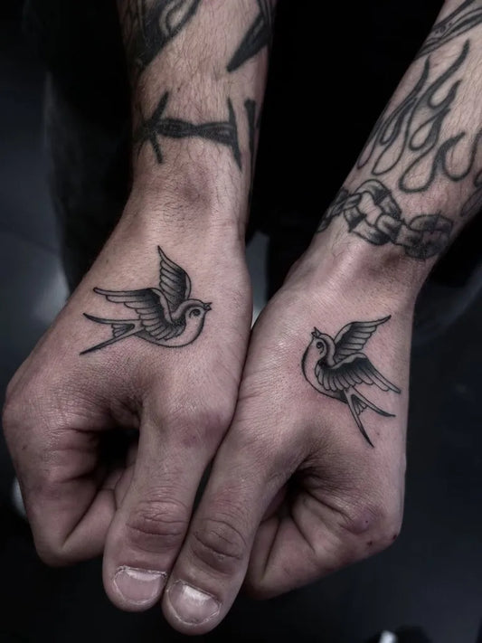 Small Blackwork Swallow Tattoo on Men Wrist by @harryhoy_tattoos