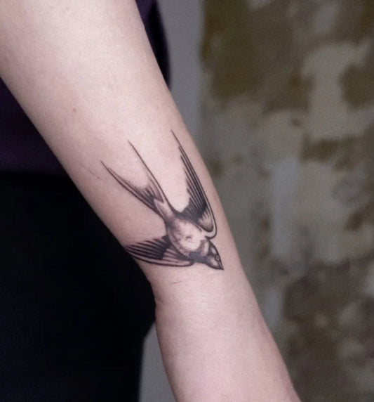 Small Blackwork Swallow Tattoo on Women Arm by @stickandchoke