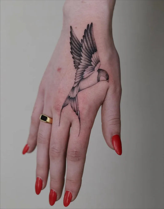 Small Blackwork Swallow Tattoo on Women Hand by @ivyklomp