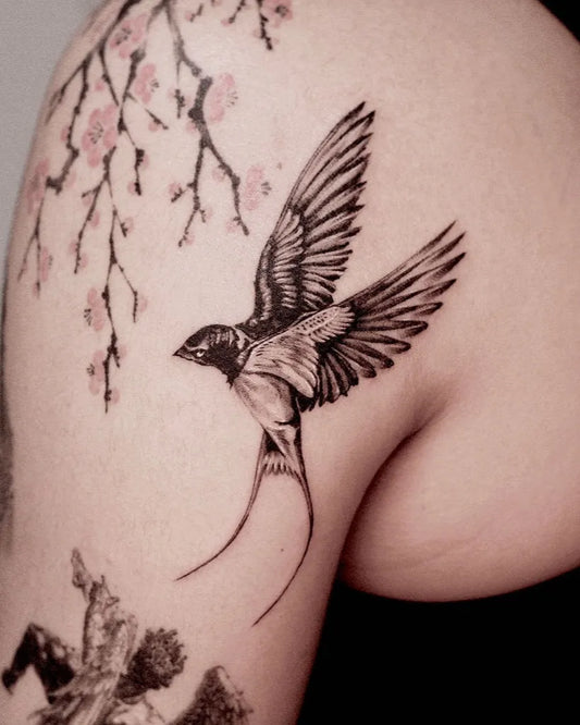 Small Blackwork Swallow and Cherry Blossom Tattoo on Women Shoulder by @sailor_solar_