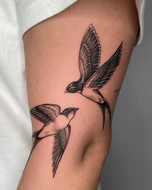 Small Blackwork Swallows Tattoo on Men Arm by @julzktattoo