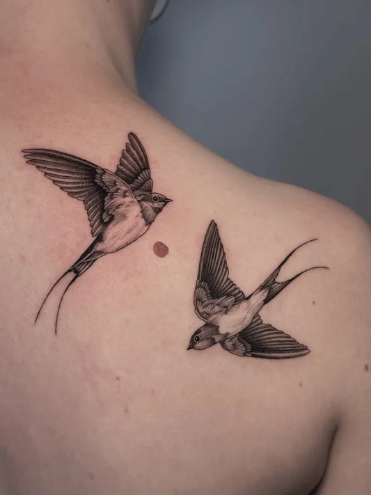 Small Blackwork Swallows Tattoo on Women Shoulder by @soulpurposetattoo