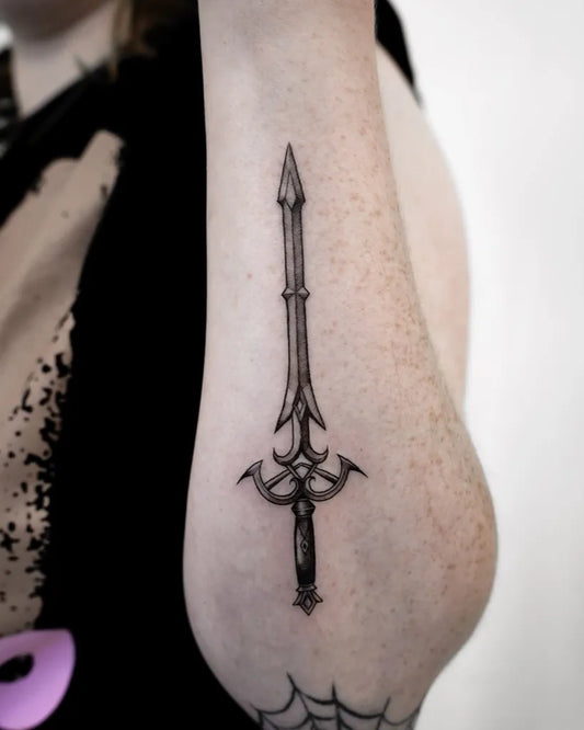 Small Blackwork Sword on Women Arm Tattoo by @extrahottattoo