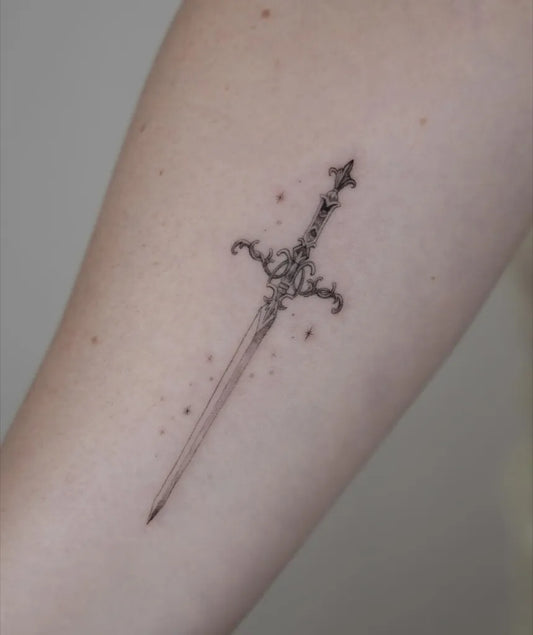 Small Blackwork Sword on Women Arm Tattoo by @jakkichantattoos