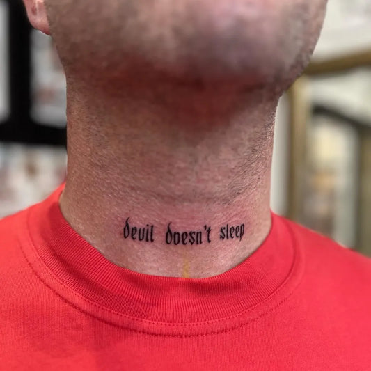Small Blackwork Text Tattoo on Men Throat by @artofseanscoular