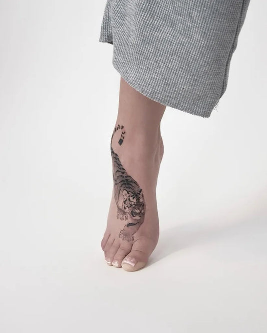 Small Blackwork Tiger Tattoo on Women Foot by @wilwang_tatt