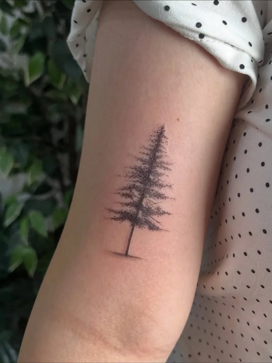 Small Blackwork Tree Tattoo on Women Arm by @hada_tatt