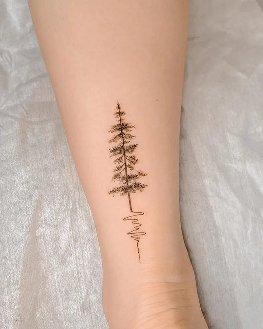 Small Blackwork Tree Tattoo on Women Leg by @dongtattoostudio