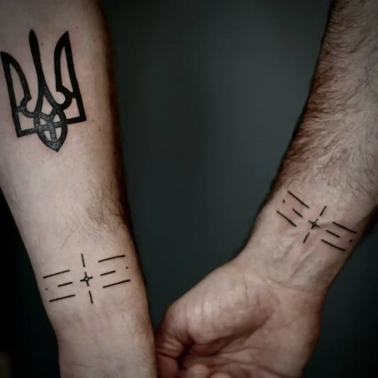 Small Blackwork Tryzub and Crosses Military Tattoo on Men Arms by @felicia_tattooo
