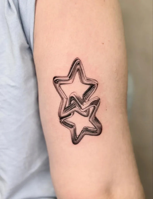 Small Blackwork Twin Stars Tattoo on Women Arm by @ulaniink