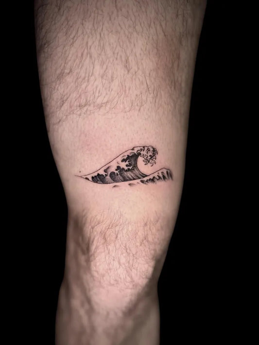 Small Blackwork Wave Tattoo on Men Thigh by @primitivetattoo