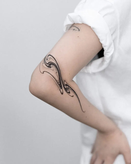 Small Blackwork Wave Tattoo on Women Arm by @vequja