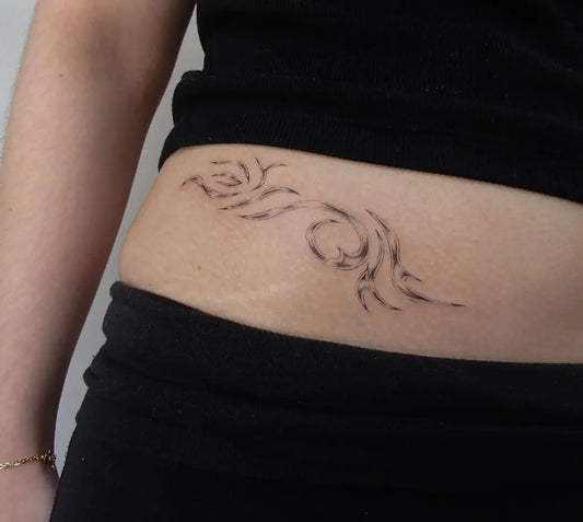 Small Blackwork Wave Tattoo on Women Stomach by @cryyourbest