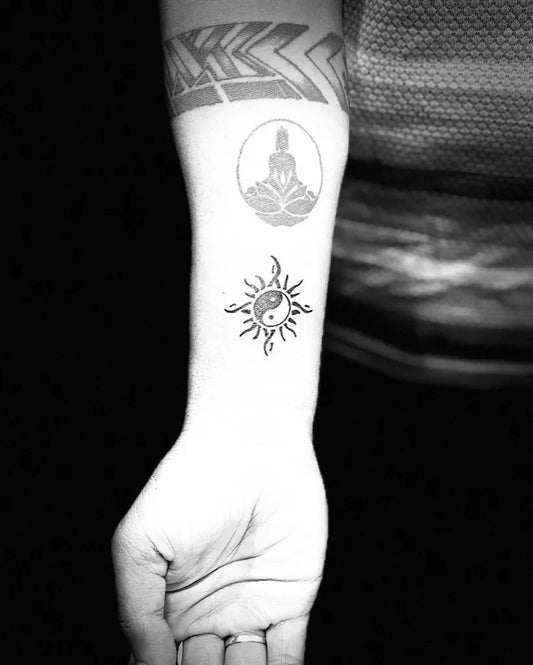 Small Blackwork Yin Yang Buddha Tattoo on Women Forearm by @mog_tattoos_goa