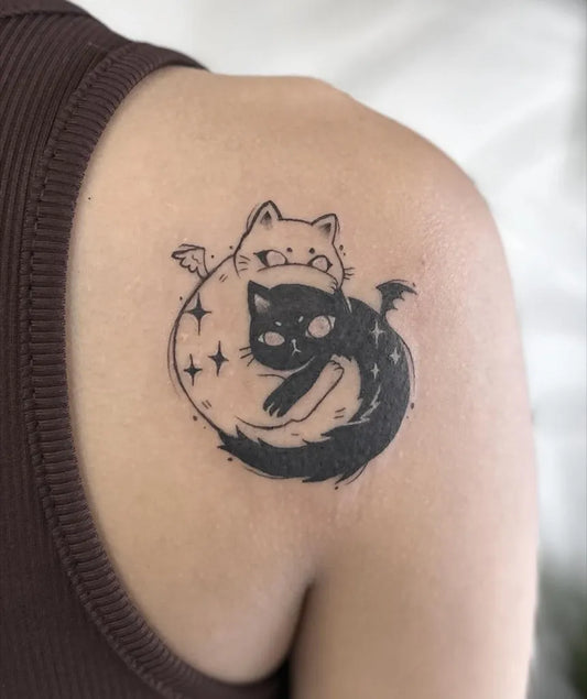 Small Blackwork Yin Yang Cat Tattoo on Women Shoulder by @inkkoela
