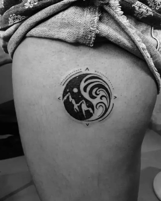 Small Blackwork Yin Yang Compass Tattoo on Women Thigh by @sandip_uttam21