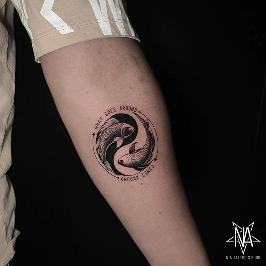 Small Blackwork Yin Yang Koi Tattoo on Women Forearm by @krishan_hamal