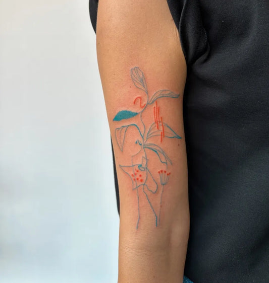 Small Blue Floral Plant Tattoo on Women Arm by @burcuerimtatt