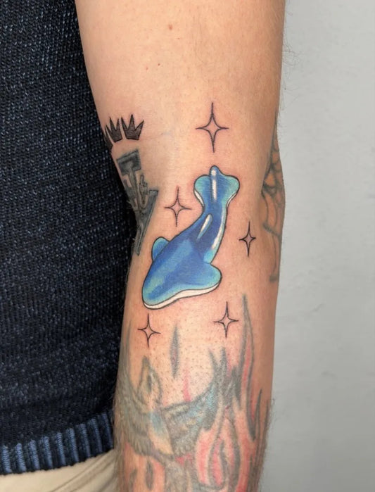 Small Blue Koi Star Tattoo on Men Arm by @mena.menaki