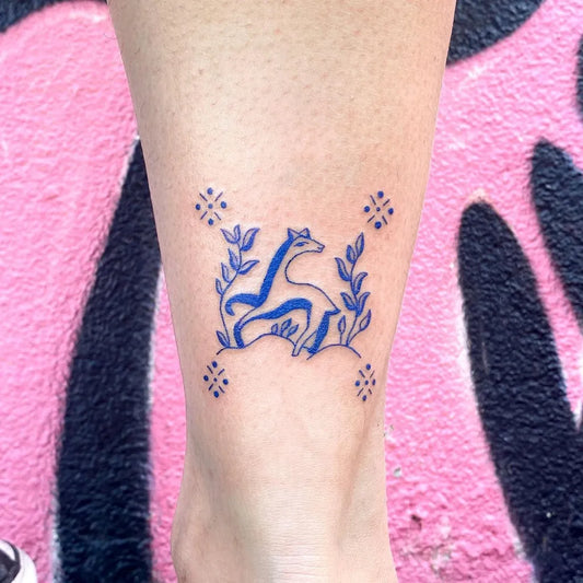 Small Blue Llama Floral Tattoo on Women Ankle by @doostuff