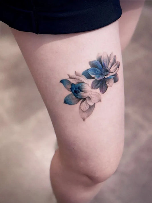 Small Blue Lotus Flowers Tattoo on Women Thigh by @winigreeni