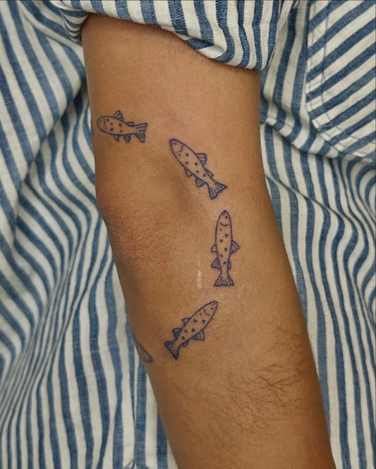 Small Blue School of Fish Tattoo on Women Arm by @meikofukimoto