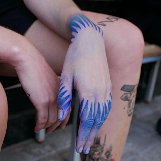 Small Blue SpikyRays Tattoo on Women Wrist by @dori.t___