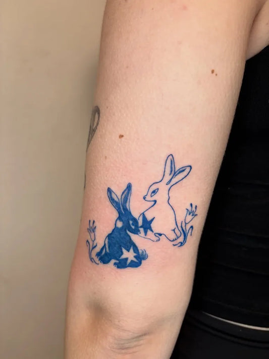 Small Blue Two Rabbits and Star Tattoo on Women Arm by @livluvstab