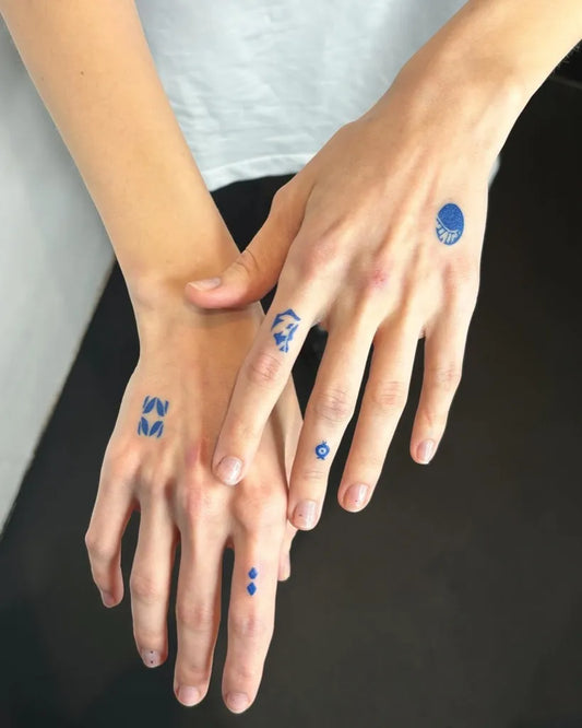 Small Blue VN Symbols Tattoo on Women Hands by @ghislain______