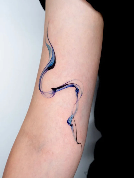 Small Blue Wavy Line Tattoo on Women Arm by @77.9tattoo