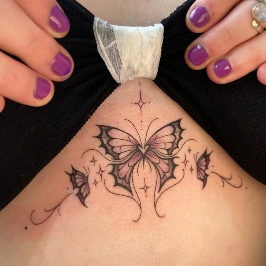 Small Butterfly Wings Butterfly on Women Sternum Tattoo by @gunbietattoos