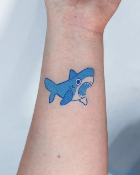 Small Cartoon Great White Shark on Women Wrist Tattoo by @y.newbro