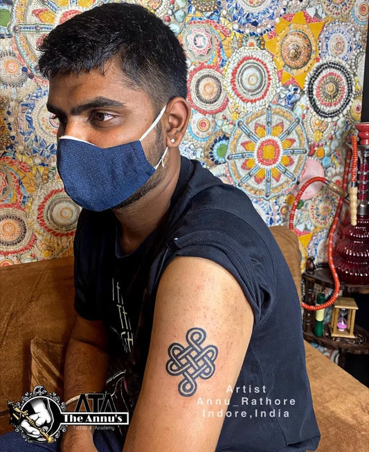 Small Celtic Endless Knot Tattoo on Men Arm by @annus_tattoo_indore