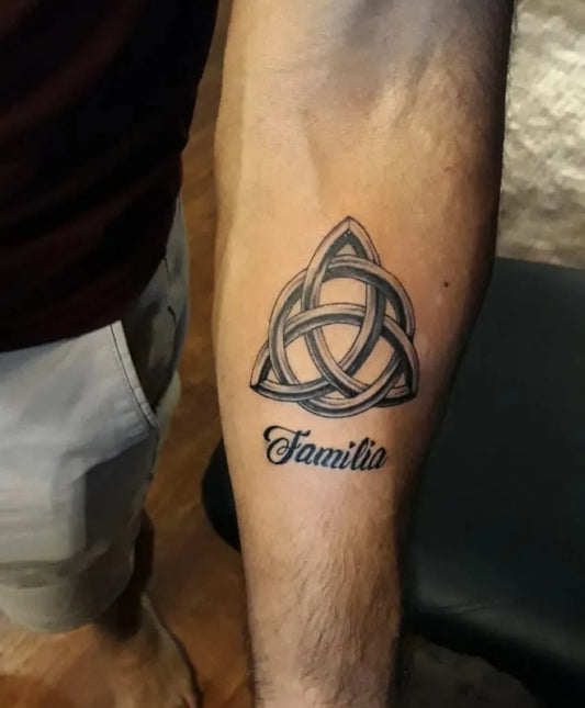 Small Celtic Triquetra and Familia Script Tattoo on Men Arm by @pashazstudio