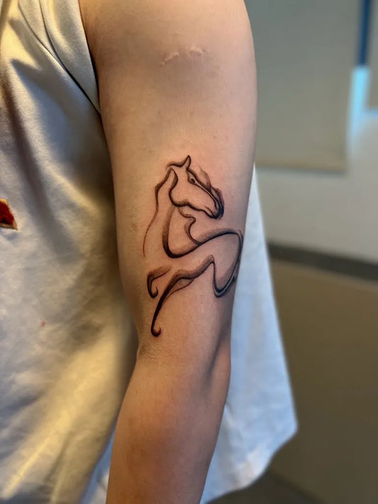Small Chinese Horse Tattoo on Men Arm by @zea_tattooist