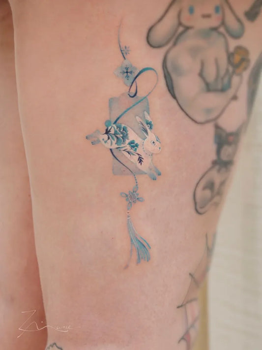 Small Chinese Rabbit Koi Tattoo on Women Leg by @romaintattoo