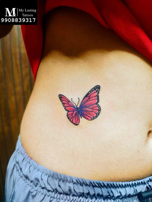 Small Colorful Butterfly on Women Waist Tattoo by @my_lasting_tattoos_hyderabad