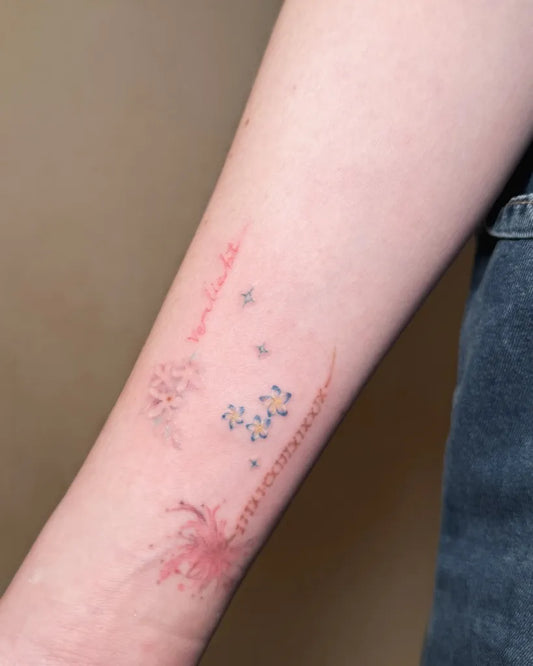 Small Colorful Flowers Script Stars Tattoo on Women Arm by @kayyang.tattoo