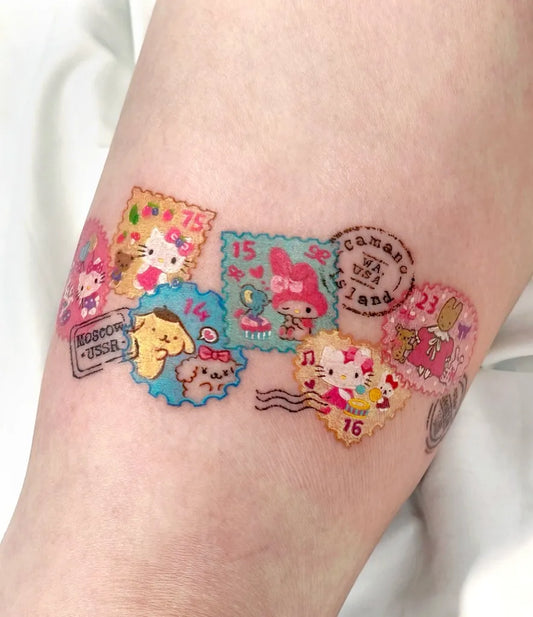Small Colorful Hello Kitty Stamps Tattoo on Women Arm by @ovenlee.tattoo