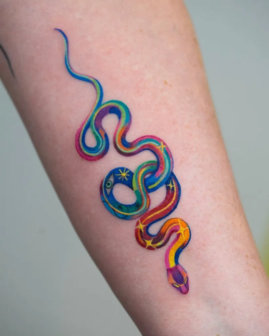 Small Colorful Snake on Women Arm Tattoo by @heeyajenny