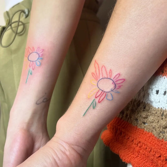 Small Colorful Sunflower Tattoo on Women Forearm by @inklike.studio