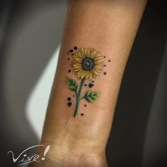 Small Colorful Sunflower Tattoo on Women Forearm by @willowtattooer