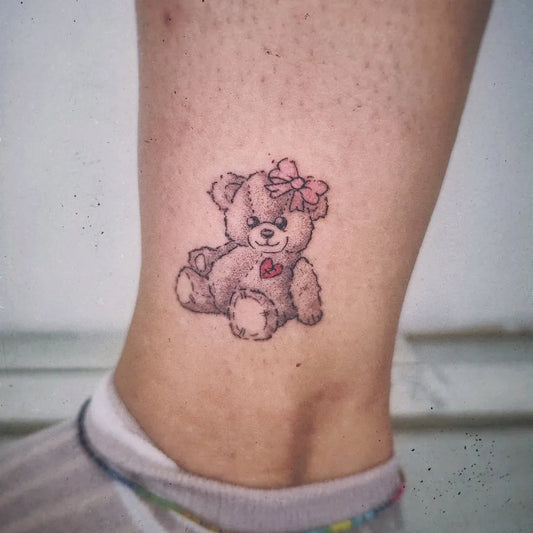 Small Cute Bear with Bow and Heart on Women Ankle Tattoo by @andre.omens