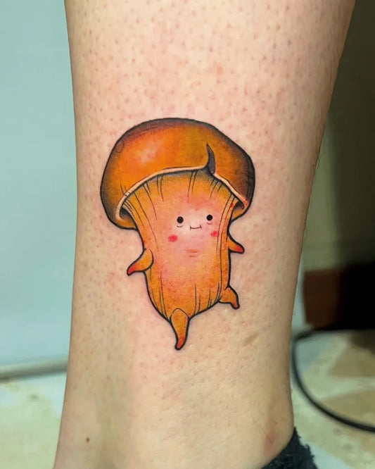 Small Cute Mushroom on Women Leg Tattoo by @laurabellini.art
