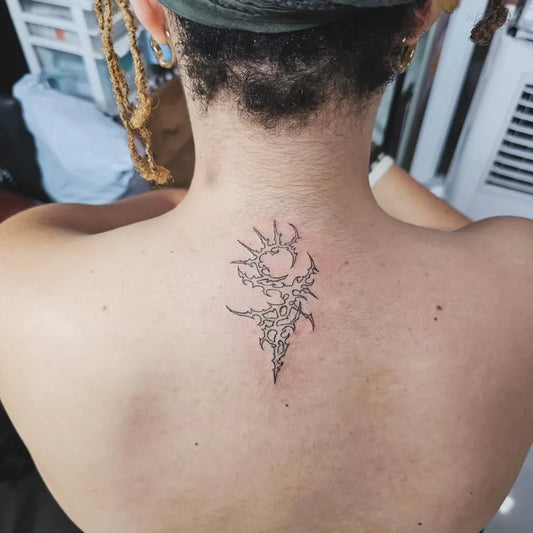 Small Cyber Sigilism on Women Back Tattoo by @bubble_brain_tattoo