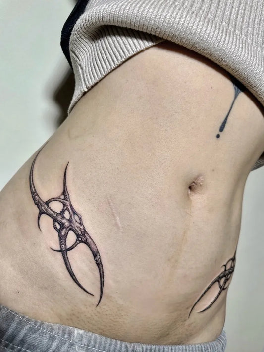 Small Cyber Sigilism on Women Hip Tattoo by @lucifugetattoo_xaxa