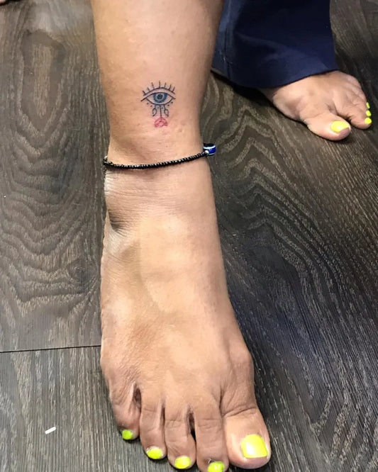 Small Delicate Evil Eye on Women Ankle Tattoo by @bigguystattoo